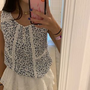 XS white shirt with blue flowers and small buttons at the top